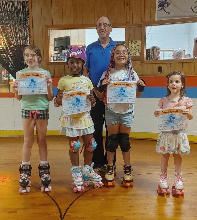 Kat, Sheniya, Yonelsi, and Allison graduate Super Skater 1